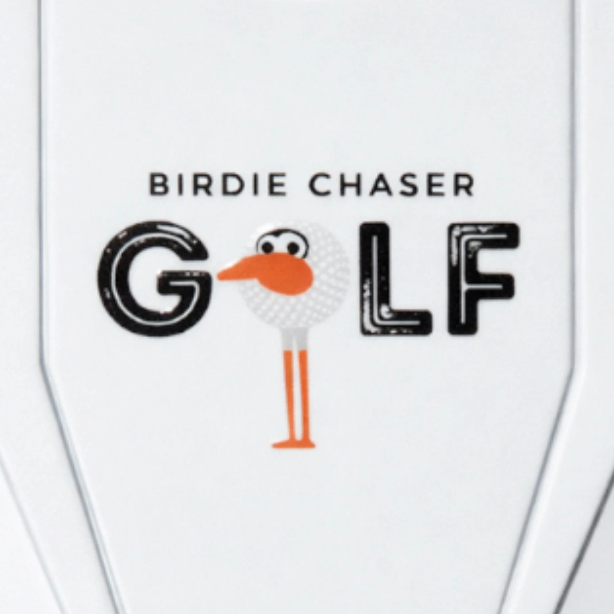 Close-up of Birdie Chaser logo on ball marker of the white divot repair tool